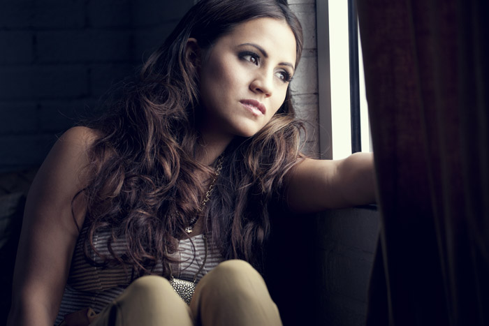 Rachael Lampa at a window